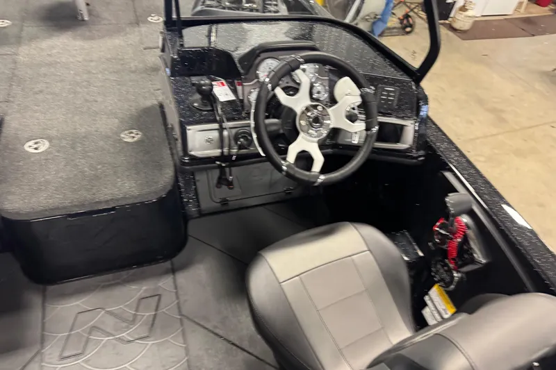 Slide: The Image of Interior of 2026 Nitro ZV21 Pro boat with steering wheel and seating. - 14