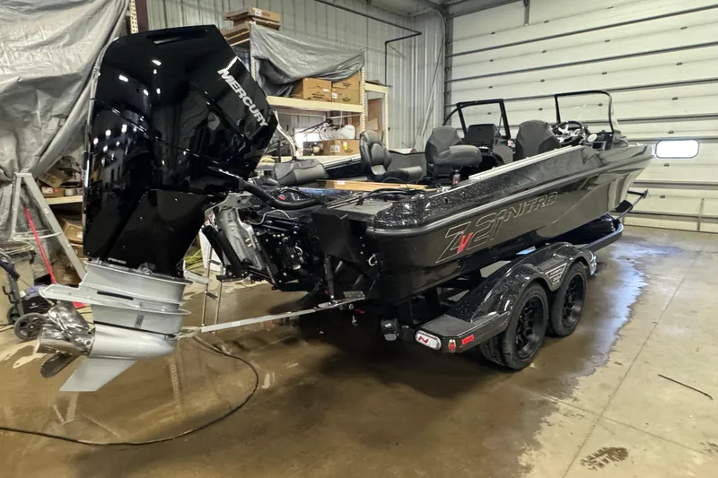 Slide: The Image of 2026 Nitro ZV21 Pro boat with Mercury engine in a garage setting. - 3