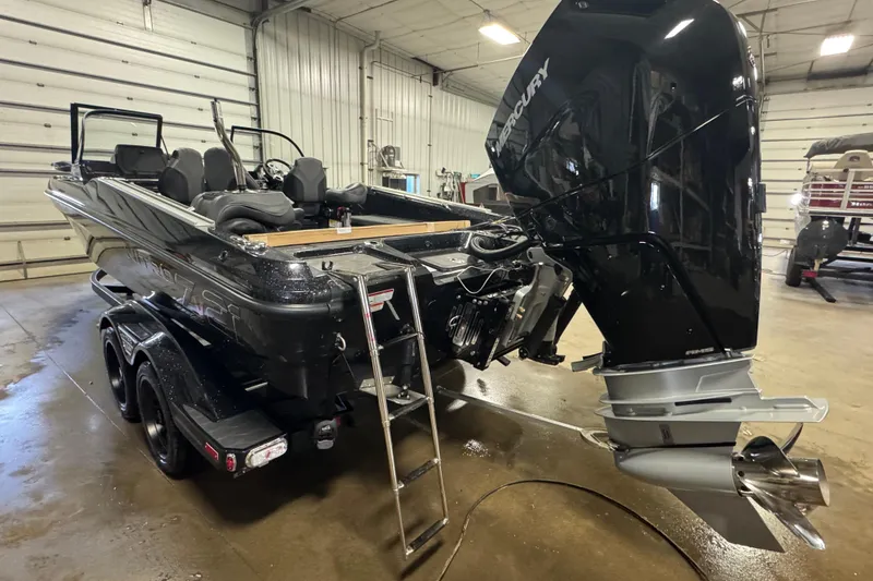 Slide: The Image of 2026 Nitro ZV21 Pro boat in garage, featuring powerful Mercury outboard motor. - 4