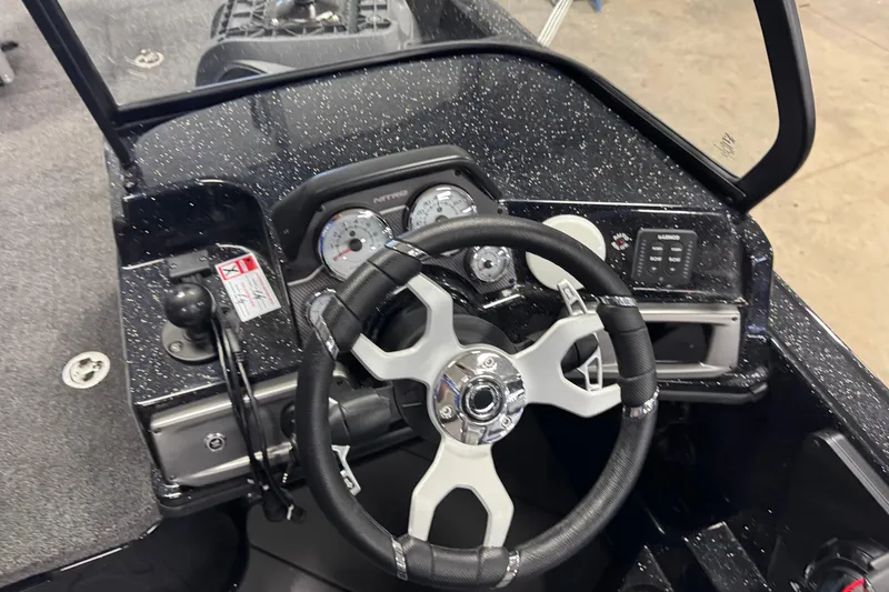 Slide: The Image of Steering console of 2026 Nitro ZV21 Pro boat with modern controls and gauges. - 6