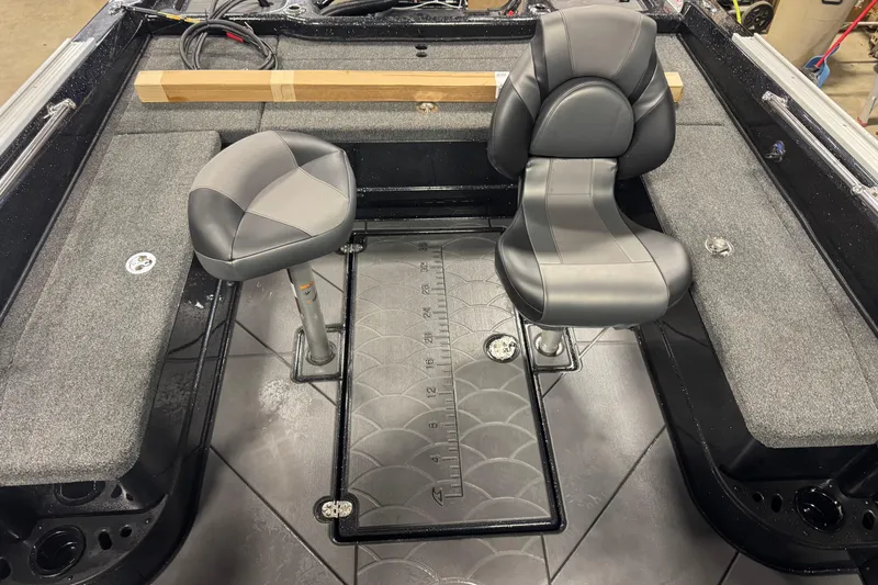 Slide: The Image of Interior of 2026 Nitro ZV21 Pro boat with two seats and carpeted flooring. - 8