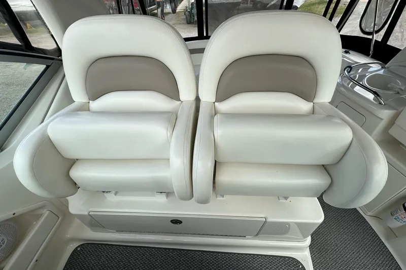 Slide: The Image of Luxury seating on 2003 Sea Ray 340 Sundancer boat, featuring plush white upholstery. - 12