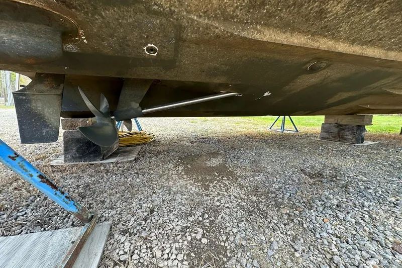 Slide: The Image of Underneath view of a 2003 Sea Ray 340 Sundancer boat on dry dock. - 22