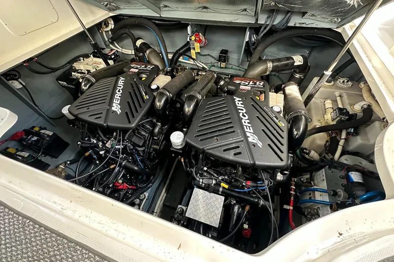 Slide: The Image of Engine compartment of a 2003 Sea Ray 340 Sundancer with twin Mercury engines. - 24