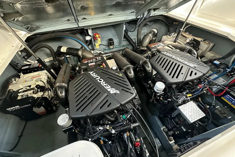 Slide: The Image of Engine compartment of a 2003 Sea Ray 340 Sundancer with twin Mercury engines. - 25