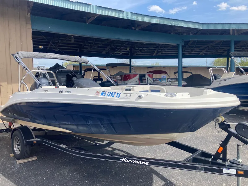 Slide: The Image of 2020 Hurricane SunDeck Sport 185 OB on trailer, blue and white design. - 3
