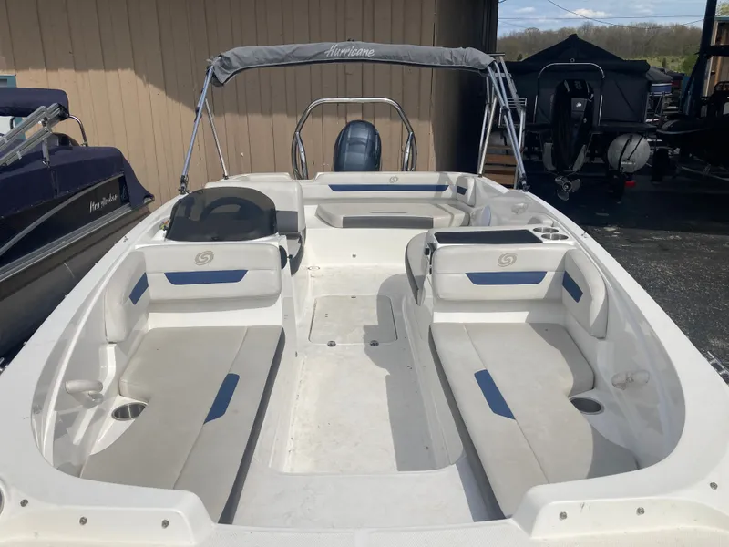 Slide: The Image of 2020 Hurricane SunDeck Sport 185 OB boat with seating and bimini top. - 5