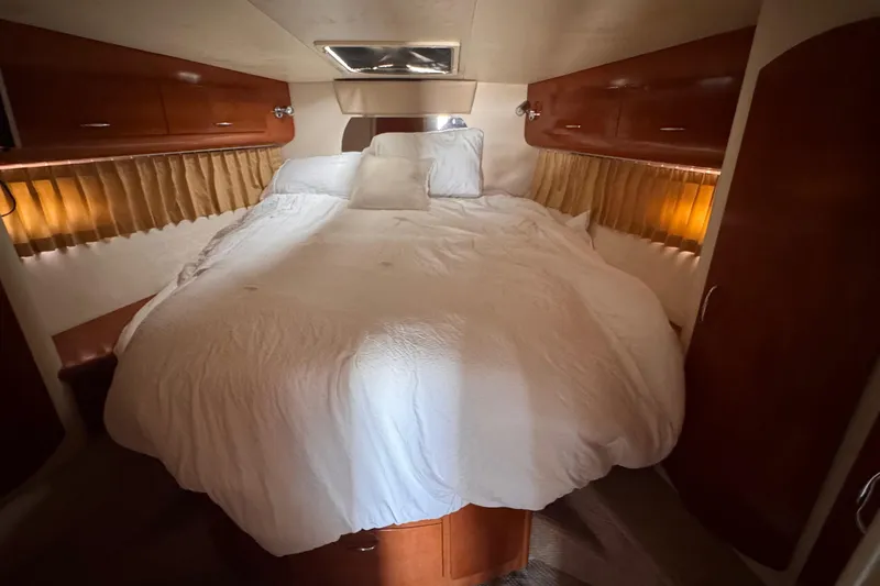 Slide: The Image of Luxurious bedroom interior of 2006 Carver 36 Mariner yacht with cozy bedding. - 10