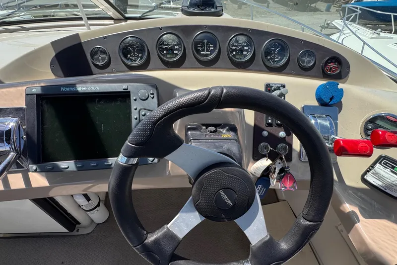 Slide: The Image of Helm of 2006 Carver 36 Mariner with steering wheel, gauges, and navigation system. - 12