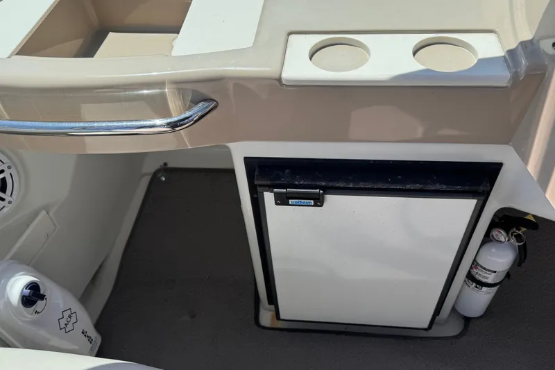 Slide: The Image of Interior of 2006 Carver 36 Mariner with mini fridge and cup holders. - 14