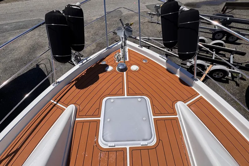 Slide: The Image of 2006 Carver 36 Mariner boat deck with wood finish and anchor system. - 16