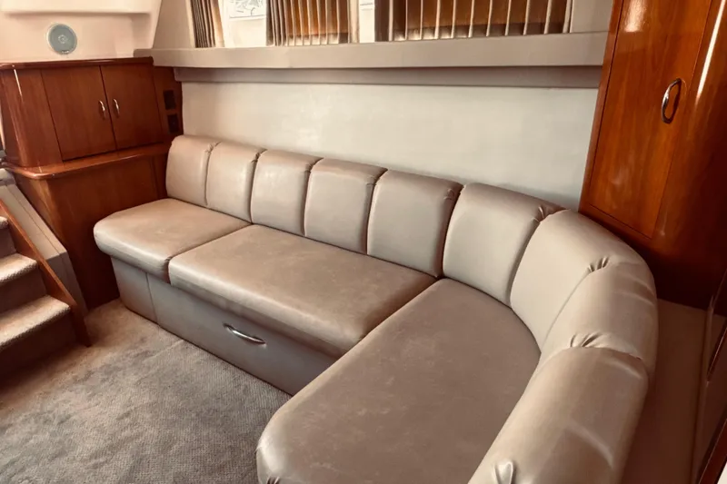 Slide: The Image of Luxurious interior of 2006 Carver 36 Mariner yacht with plush beige seating. - 7