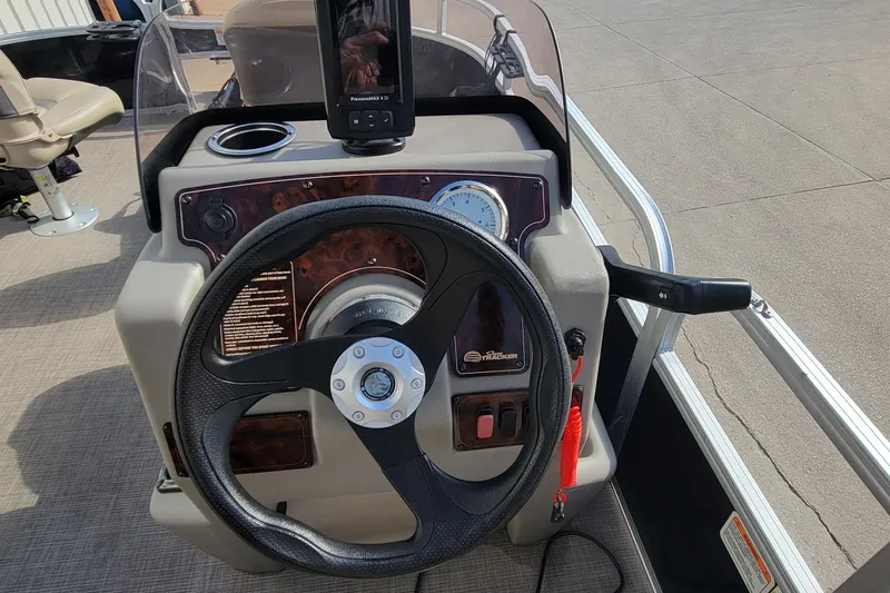 Slide: The Image of Steering console of 2022 SUNTRACKER BASS BUGGY 16 XLS pontoon boat. - 19