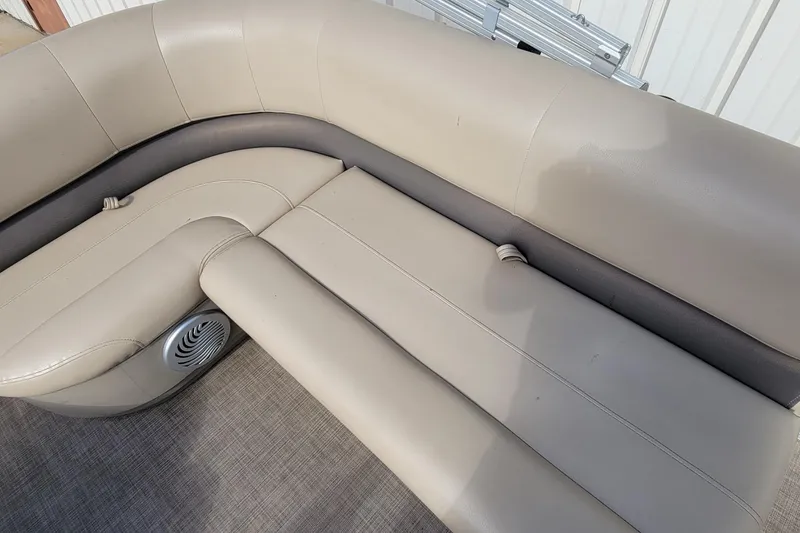 Slide: The Image of 2022 SUNTRACKER BASS BUGGY 16 XLS boat seating with beige upholstery and speaker. - 24