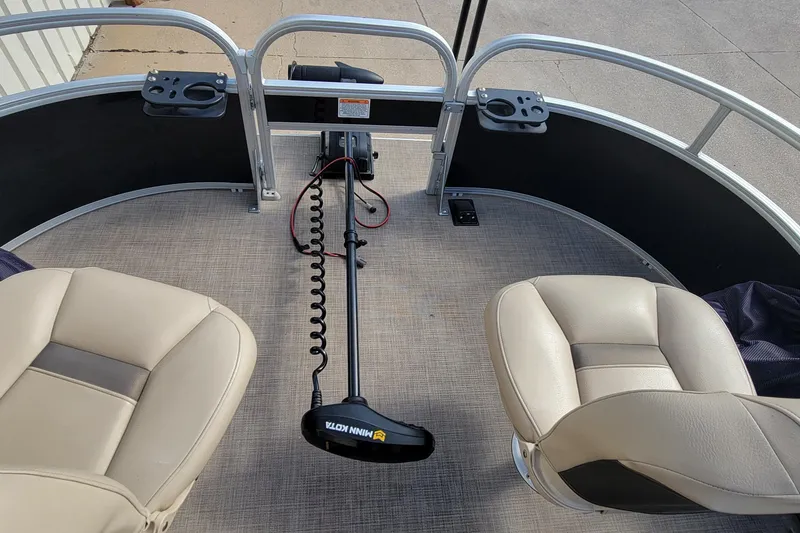 Slide: The Image of Interior view of 2022 SUNTRACKER BASS BUGGY 16 XLS pontoon boat with seating and trolling motor. - 26