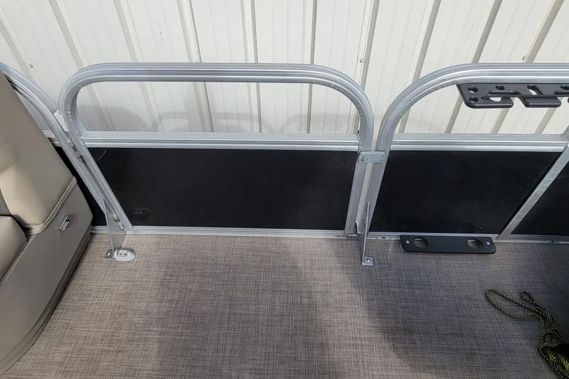 Slide: The Image of 2022 SUNTRACKER BASS BUGGY 16 XLS interior with metal railing and seating. - 30