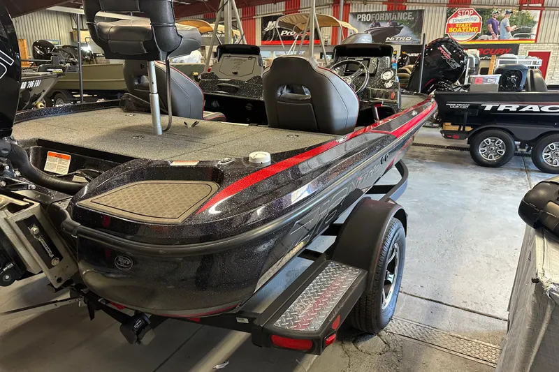 Slide: The Image of 2021 Nitro Z18 Pro fishing boat in showroom, featuring sleek design and modern equipment. - 12