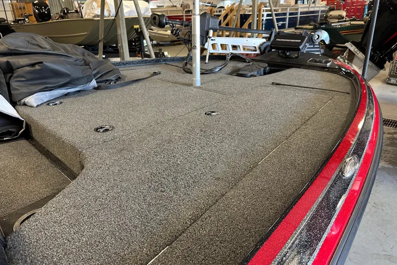 Slide: The Image of 2021 Nitro Z18 Pro boat deck with carpeted surface and fishing equipment. - 17