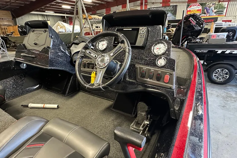 Slide: The Image of Interior of a 2021 Nitro Z18 Pro boat with steering wheel and dashboard controls. - 20