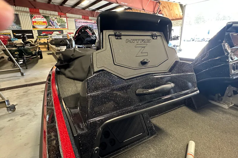 Slide: The Image of Nitro Z18 Pro 2021 boat interior with storage compartment in showroom setting. - 24