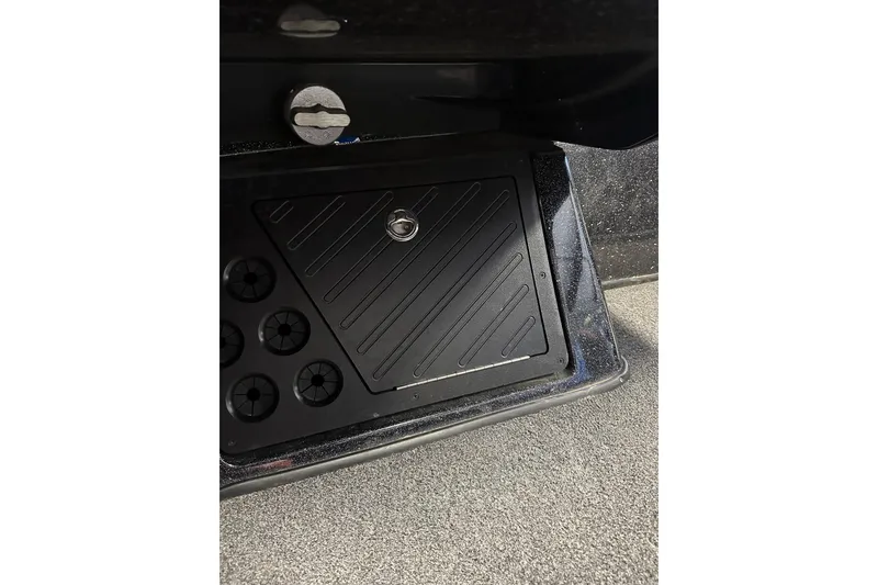 Slide: The Image of 2021 Nitro Z18 Pro boat compartment with secure lock and organized storage. - 29