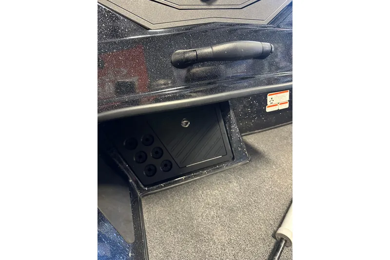 Slide: The Image of Control panel of a 2021 Nitro Z18 Pro boat, featuring switches and textured surfaces. - 30