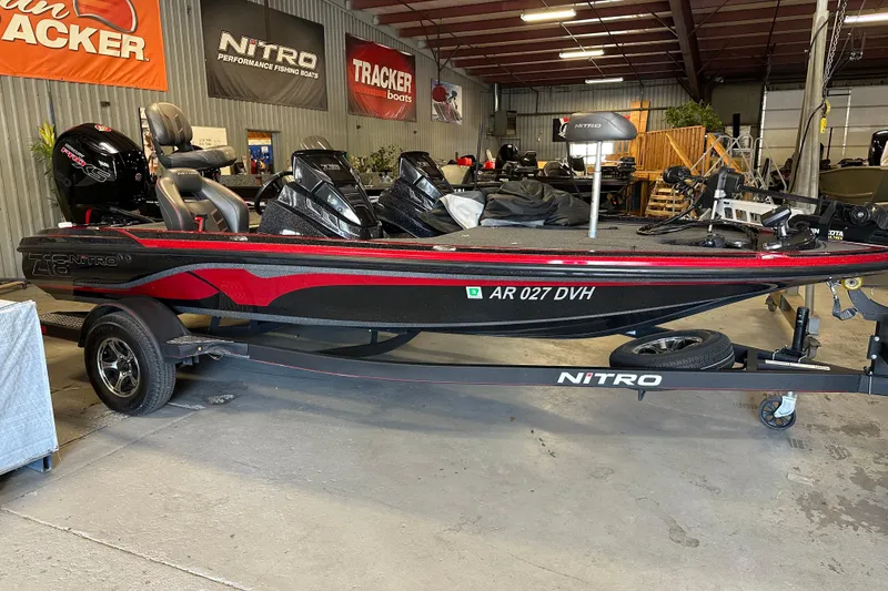 The Image of Nitro Z18 Pro 2021 fishing boat in showroom, featuring sleek red and black design. - 5