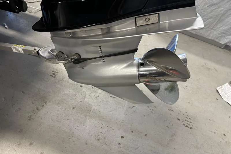 Slide: The Image of Close-up of a 2021 Nitro Z18 Pro boat propeller on a concrete floor. - 9