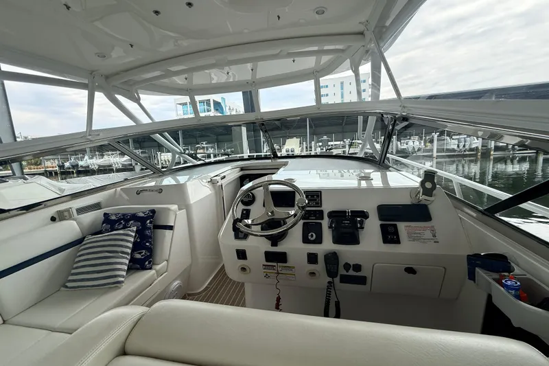 Slide: The Image of Cockpit of 2016 Intrepid 430 Sport Yacht with steering wheel and control panel. - 16