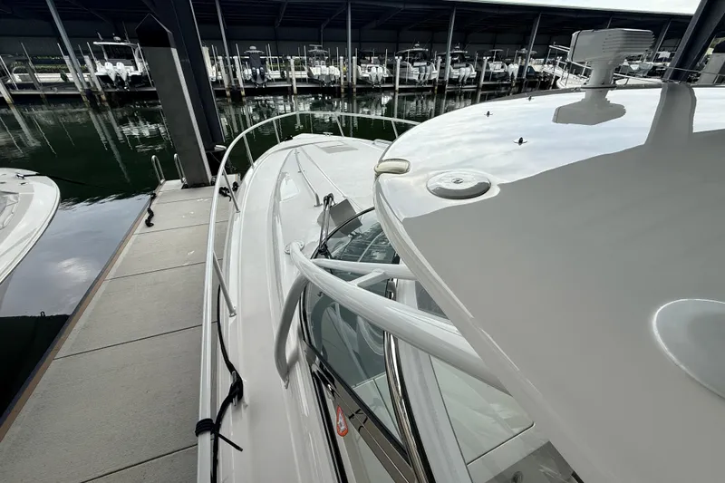 Slide: The Image of 2016 Intrepid 430 Sport Yacht docked at marina, showcasing sleek design and modern features. - 23