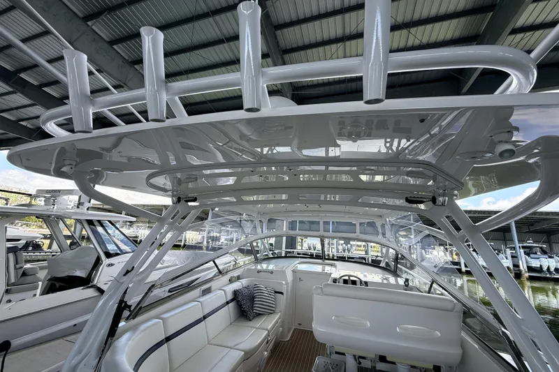 Slide: The Image of Interior view of a 2016 Intrepid 430 Sport Yacht under a covered dock. - 26