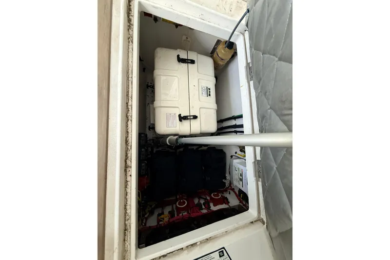 Slide: The Image of Storage compartment of a 2016 Intrepid 430 Sport Yacht, featuring equipment and wiring. - 28