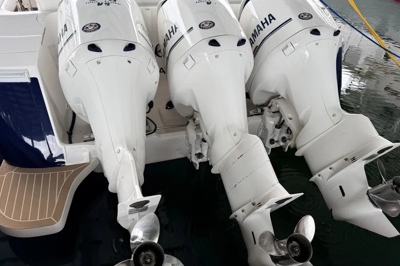 Slide: The Image of Triple Yamaha outboard engines on a 2016 Intrepid 430 Sport Yacht. - 32