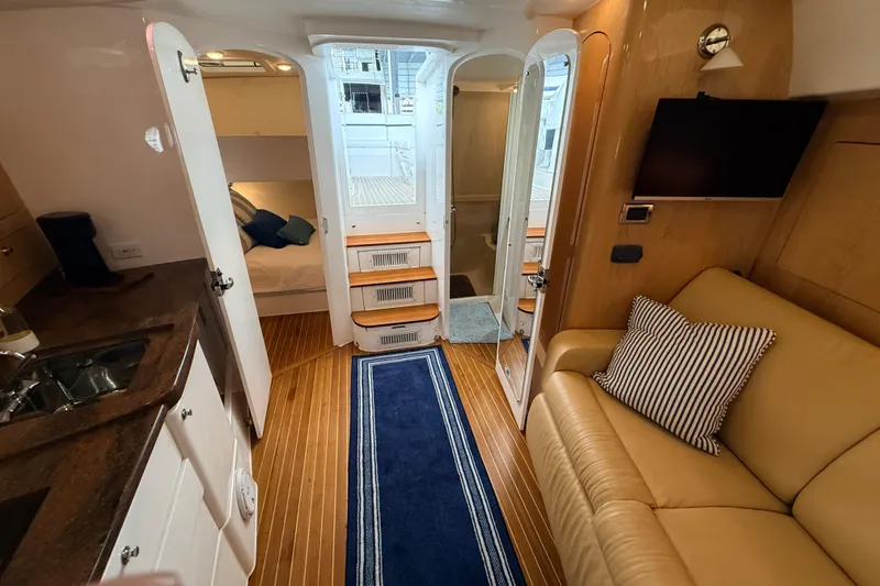 Slide: The Image of Interior of 2016 Intrepid 430 Sport Yacht with cozy seating and modern amenities. - 5