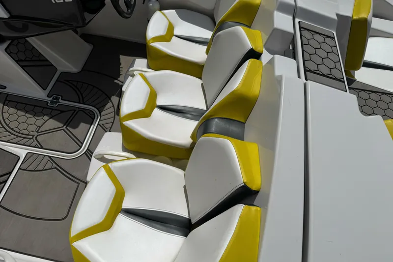 Slide: The Image of Interior seating of 2017 Scarab 165 G boat with yellow and white upholstery. - 14
