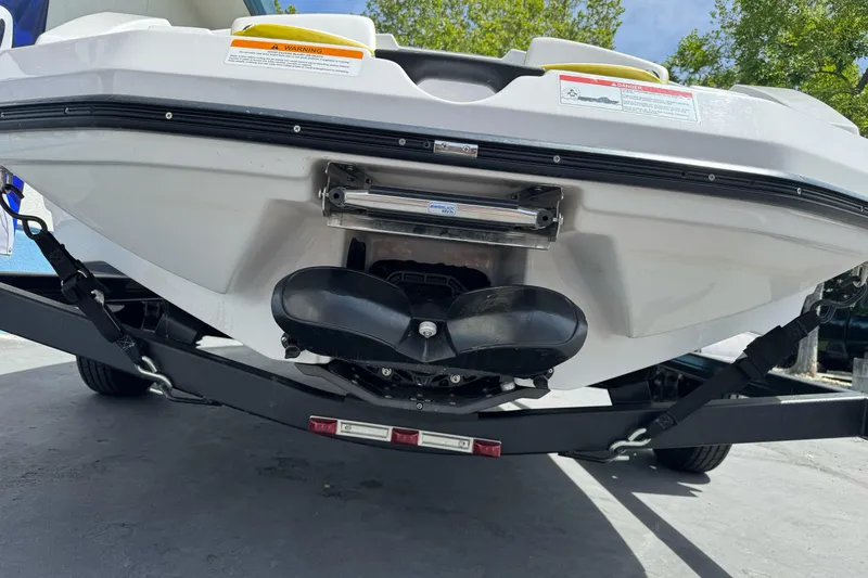 Slide: The Image of Rear view of a 2017 Scarab 165 G boat on a trailer. - 16