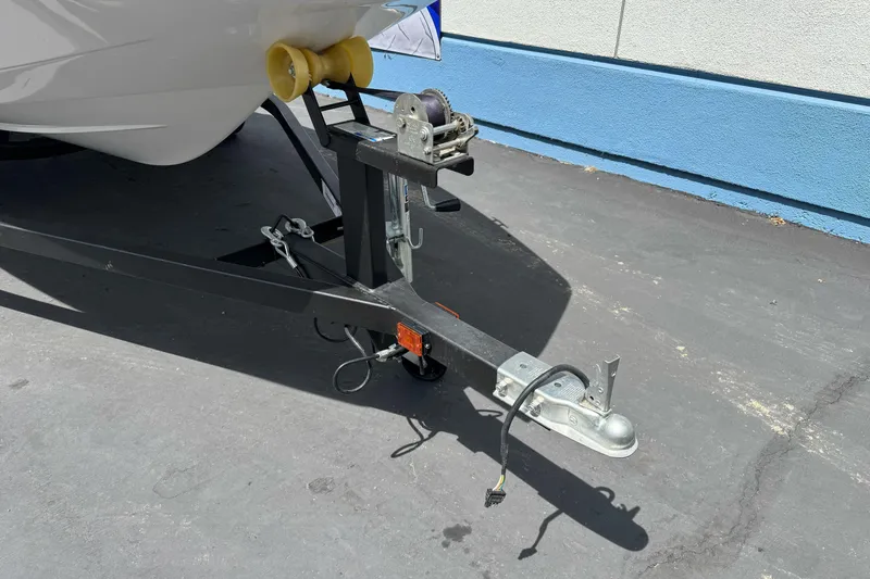Slide: The Image of Trailer hitch of a 2017 Scarab 165 G boat on pavement. - 6