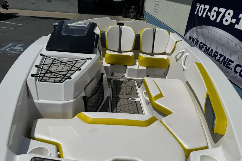 Slide: The Image of 2017 Scarab 165 G boat interior with yellow and white seating, net storage, and modern design. - 7