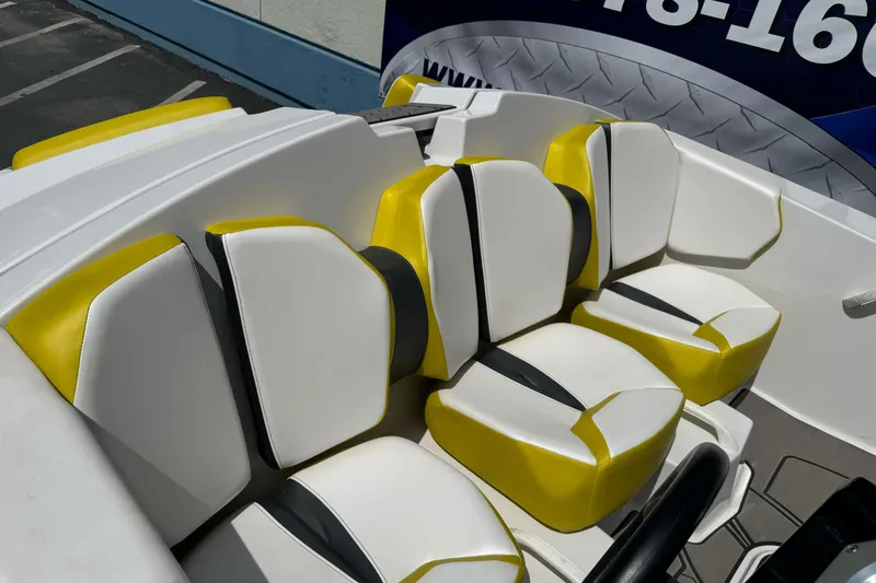 Slide: The Image of 2017 Scarab 165 G boat interior with yellow and white seating. - 8