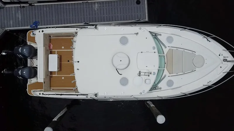 Slide: The Image of Overhead view of 2014 Wellcraft 340 Coastal boat docked at marina. - 8