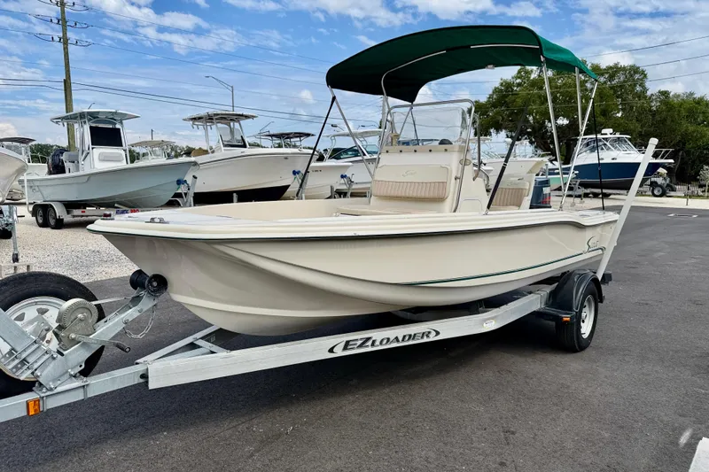 Slide: The Image of 2001 Scout 172 Sportfish boat on EZ Loader trailer, parked outdoors. - 1