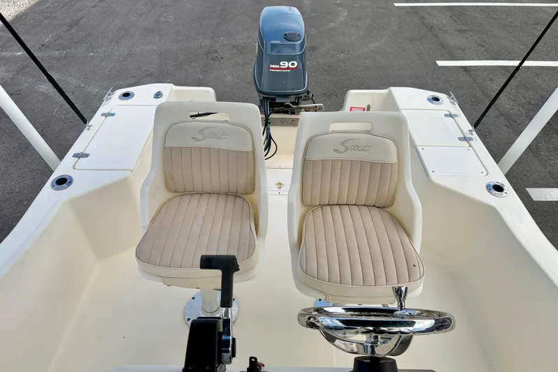 Slide: The Image of 2001 Scout 172 Sportfish boat interior with dual seats and Yamaha outboard motor. - 12