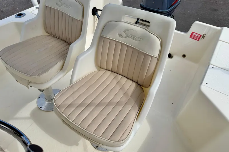 Slide: The Image of 2001 Scout 172 Sportfish boat seats with beige upholstery and Scout logo. - 13