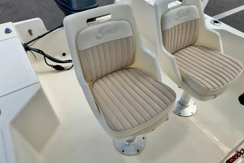 Slide: The Image of Two beige cushioned seats on a 2001 Scout 172 Sportfish boat. - 14