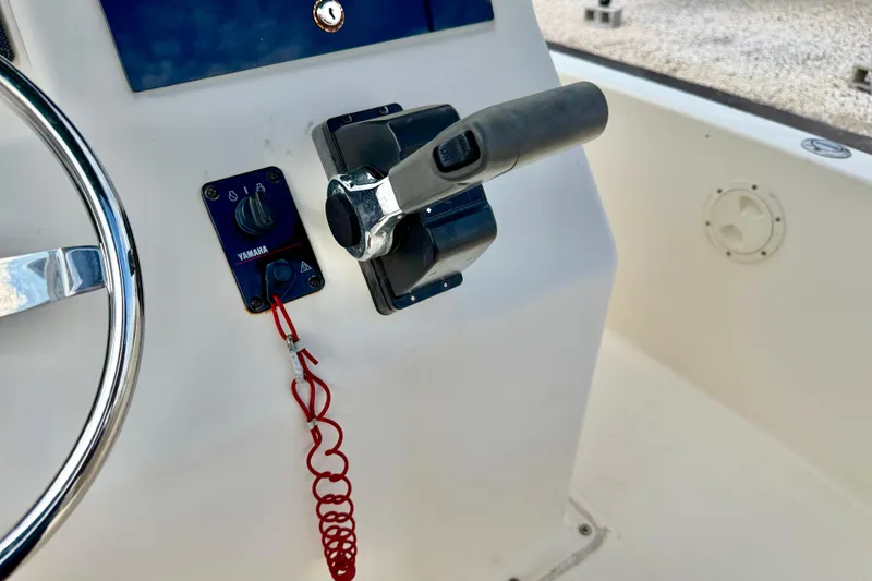 Slide: The Image of Close-up of 2001 Scout 172 Sportfish boat controls with Yamaha throttle. - 18