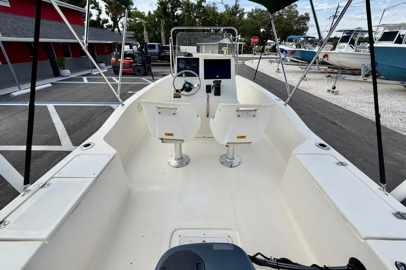 Slide: The Image of 2001 Scout 172 Sportfish boat interior with steering console and seating. - 21