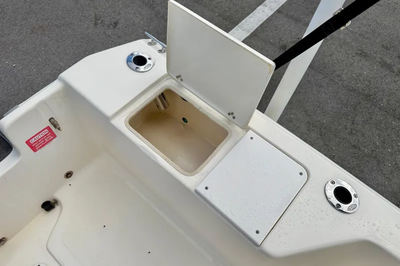 Slide: The Image of Open storage compartment on a 2001 Scout 172 Sportfish boat deck. - 23