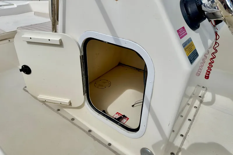 Slide: The Image of Open storage compartment on a 2001 Scout 172 Sportfish boat. - 26