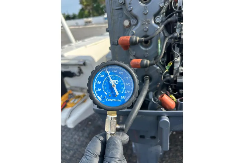 Slide: The Image of Compression gauge reading on a 2001 Scout 172 Sportfish engine. - 30
