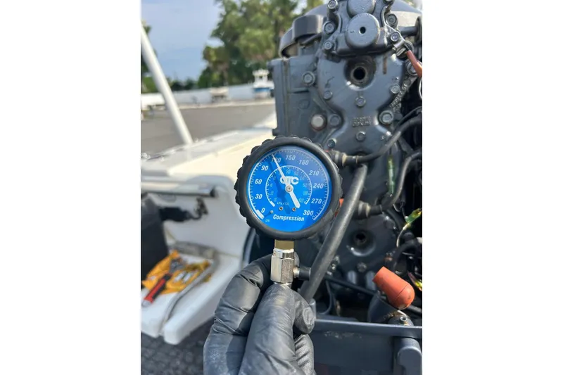 Slide: The Image of Compression gauge reading on a 2001 Scout 172 Sportfish engine. - 31